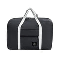 Bolsa de viaje plegable de nailon impermeable de Variedad Online en color gris oscuro con asas blancas y bolsillo frontal con cremallera.