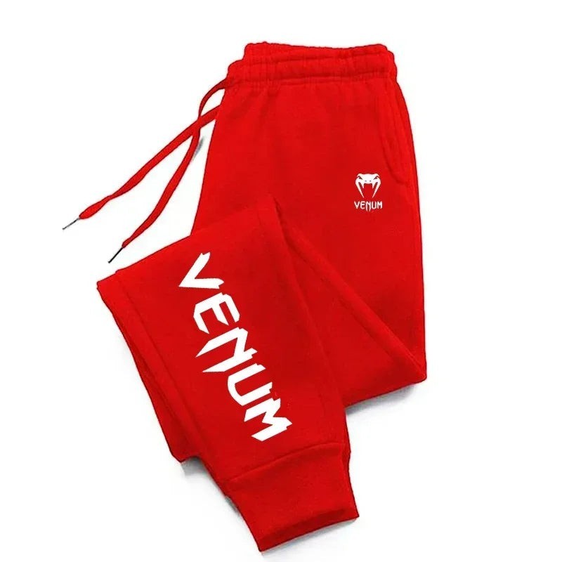 Pantalones de chándal de entrenamiento rojos Venum para hombre con logo blanco en el muslo y puños acanalados.