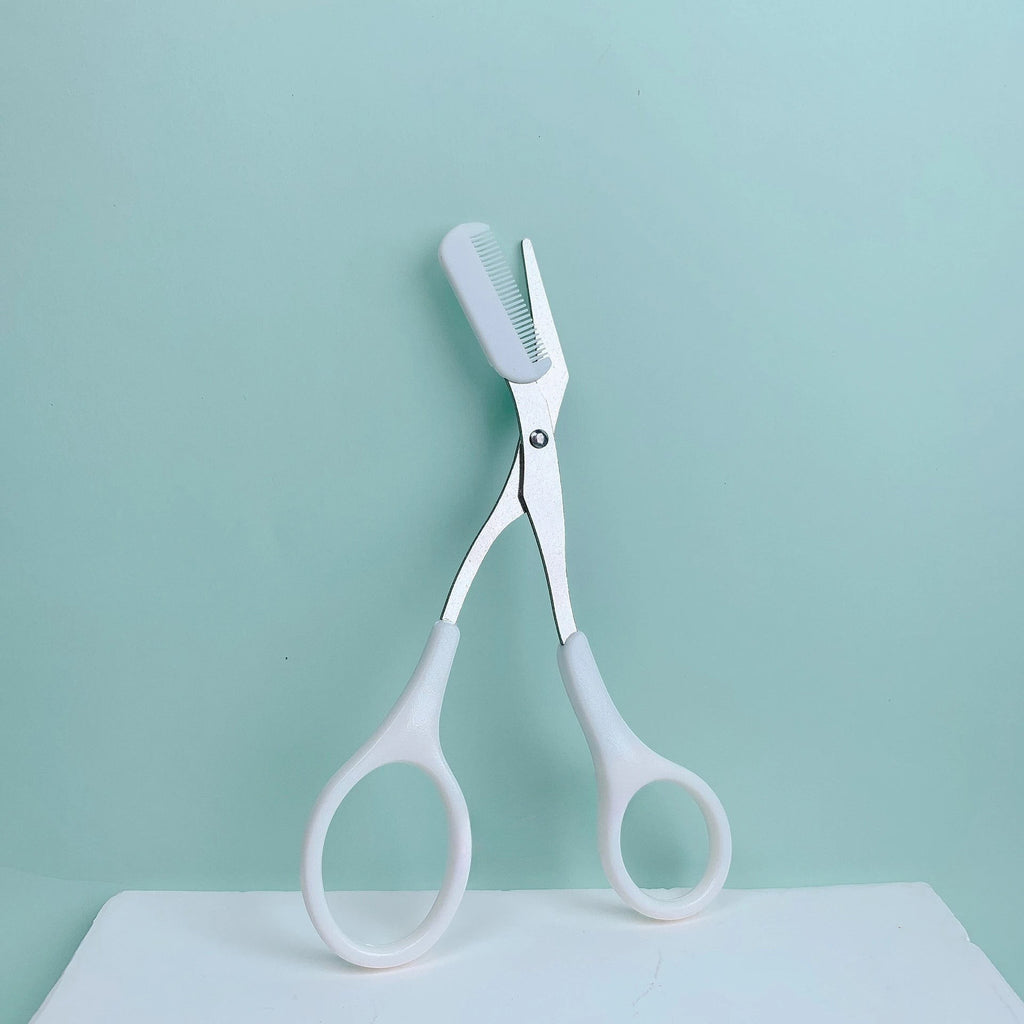 Variedad Online tijeras para cejas rosas con peine integrado para recortar y dar forma a las cejas con precisión.
